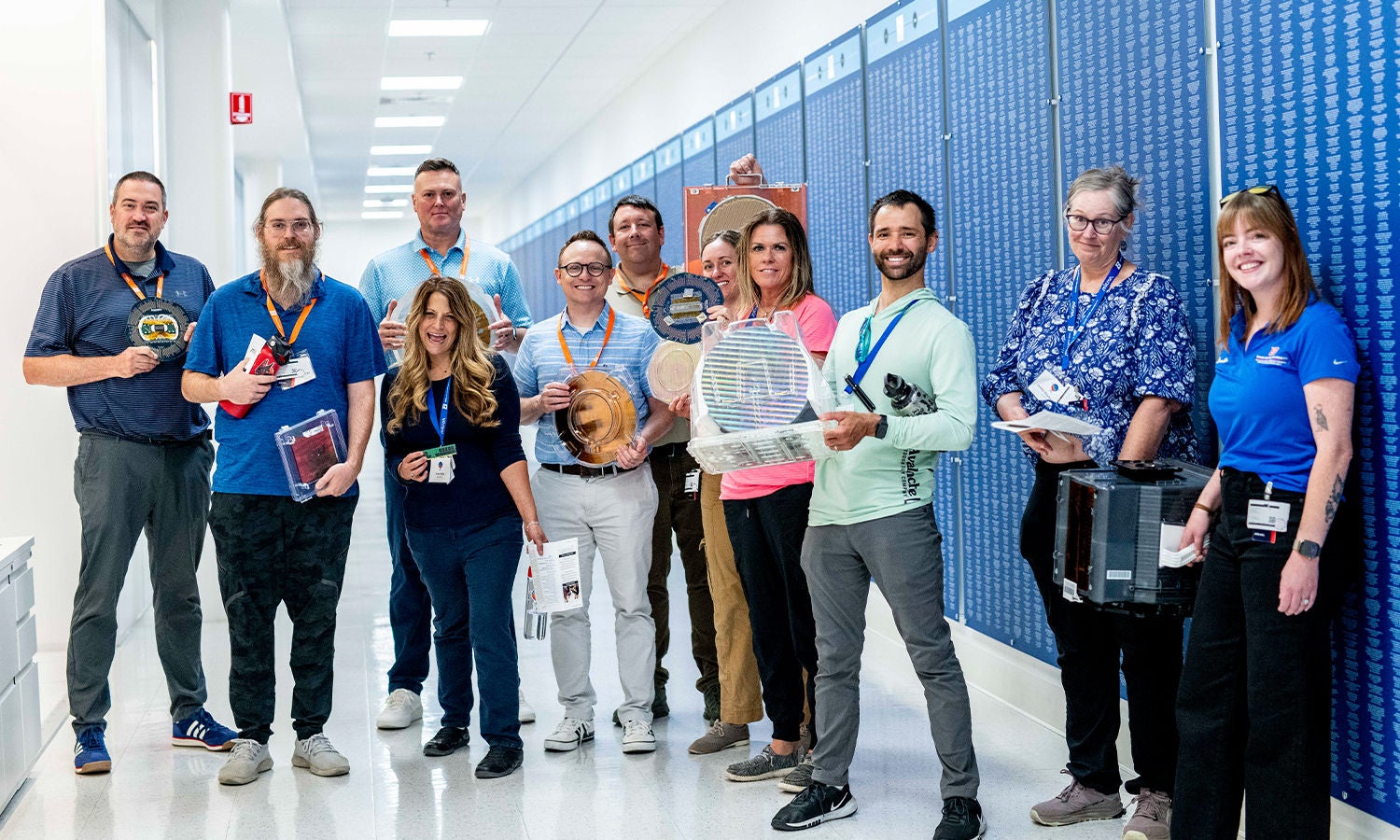 A group of educators pose smiling on a tour of Micron’s Boise site