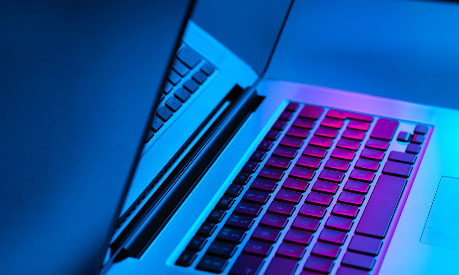 Computer keyboard in colourful background 